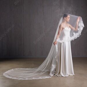 Cathedral long wedding veil with lace trim. Two tier veil with fingertip length